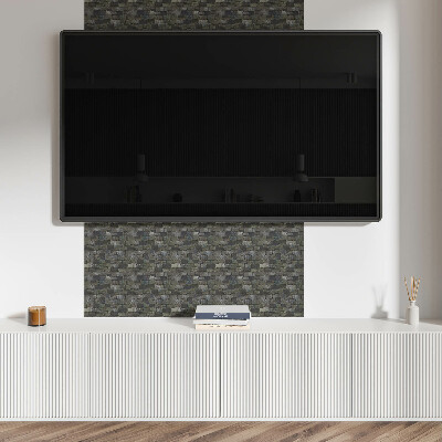 Self adhesive vinyl floor tiles A pattern imitating a stone wall
