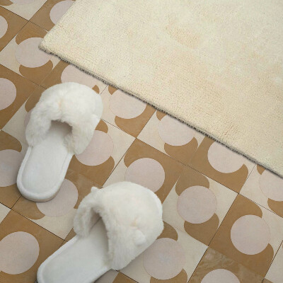 Self adhesive vinyl floor tiles A motif of circles and arcs in a geometric style