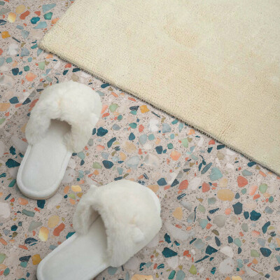Self adhesive vinyl floor tiles A motif with various stones