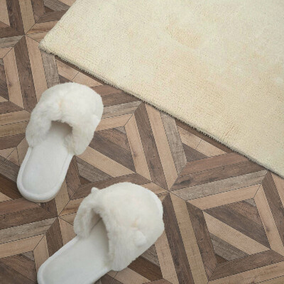 Self adhesive vinyl floor tiles A motif of natural boards in shades of brown