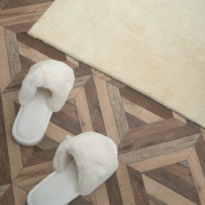 Self adhesive vinyl floor tiles A motif of natural boards in shades of brown
