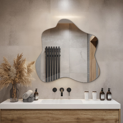 Mirror with asymmetrical stain