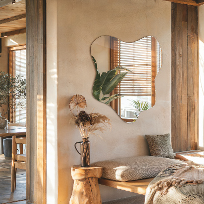 Mirror with asymmetrical stain