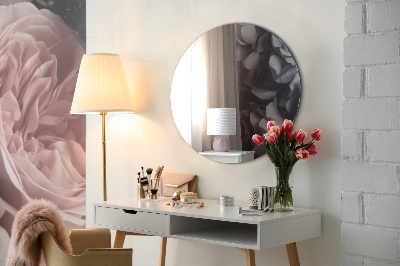 Decorative round mirror on the wall without frame