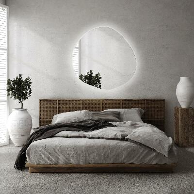 Irregular shaped lighted mirror