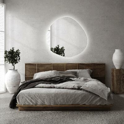 Irregular shaped lighted mirror