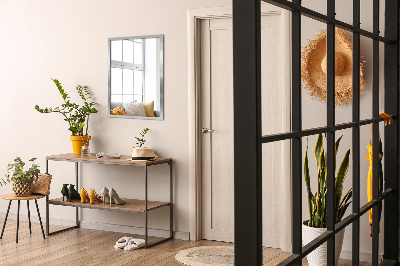 Rectangular wall hanging mirror with a silver frame