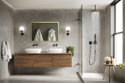 Decorative rectangular wall mirror with a gold frame