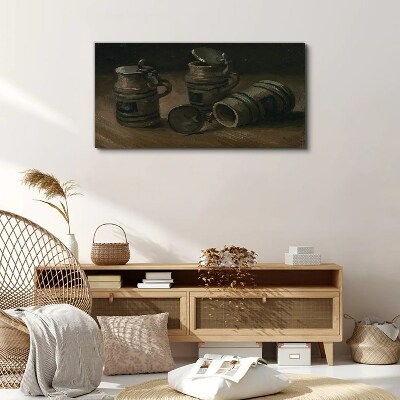 Antique mugs on the table Canvas print