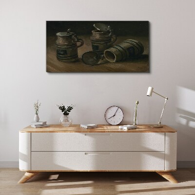 Antique mugs on the table Canvas print