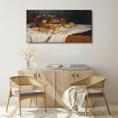 Fruit basket on a white tablecloth Canvas print