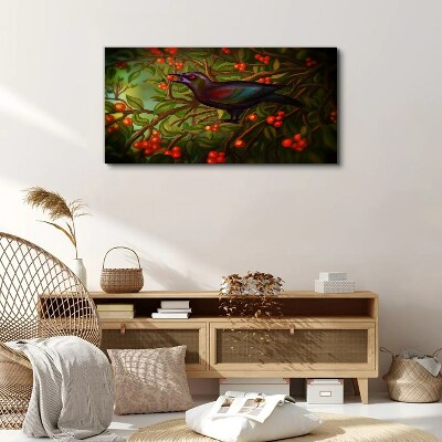 A bird on a fruit branch in the background Canvas print