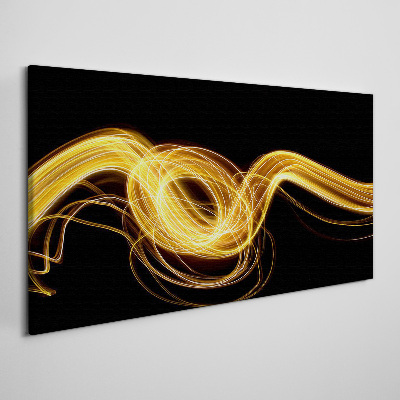 Golden streaks of light on black Canvas print