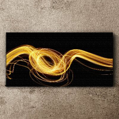 Golden streaks of light on black Canvas print