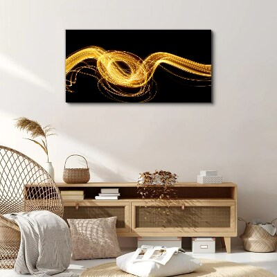 Golden streaks of light on black Canvas print