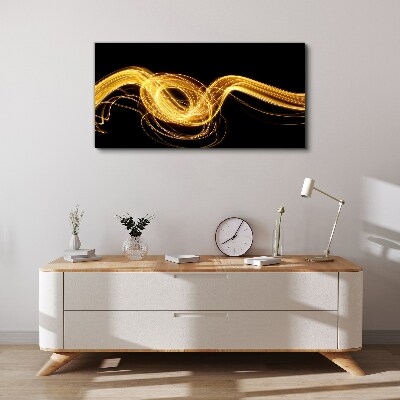 Golden streaks of light on black Canvas print
