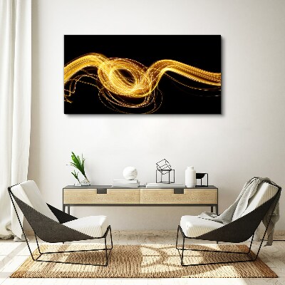 Golden streaks of light on black Canvas print