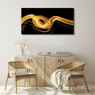Golden streaks of light on black Canvas print