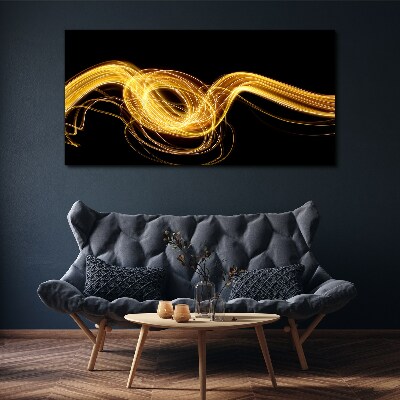 Golden streaks of light on black Canvas print
