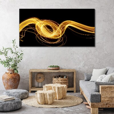 Golden streaks of light on black Canvas print