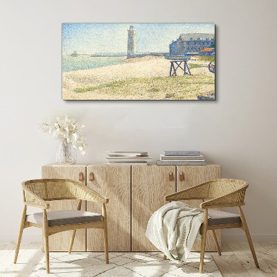 A lighthouse on the seashore Canvas print
