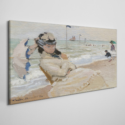 Woman on the beach with an umbrella Canvas print