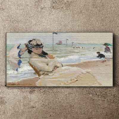 Woman on the beach with an umbrella Canvas print