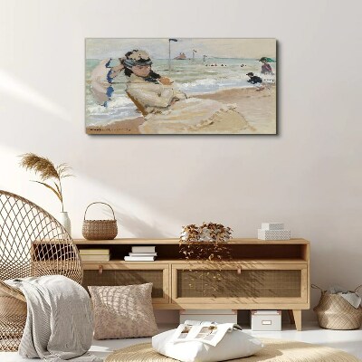 Woman on the beach with an umbrella Canvas print