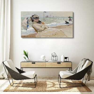 Woman on the beach with an umbrella Canvas print