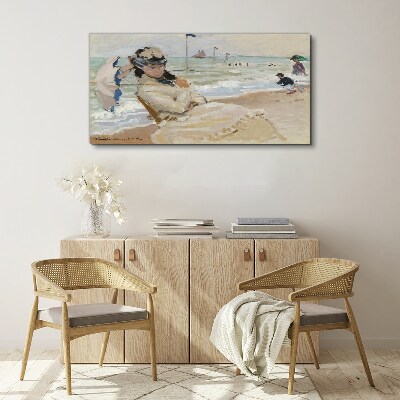 Woman on the beach with an umbrella Canvas print