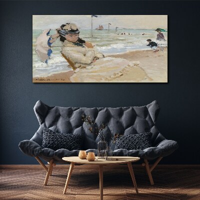 Woman on the beach with an umbrella Canvas print