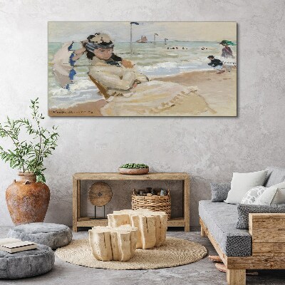 Woman on the beach with an umbrella Canvas print