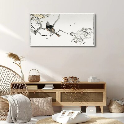 A bird on a branch in delicate colors Canvas print