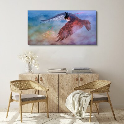 Flight of a bird of prey in the clouds Canvas Wall art