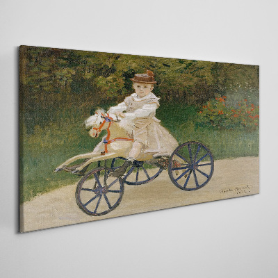 Child on a ride-on Canvas Wall art