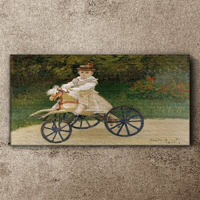 Child on a ride-on Canvas Wall art
