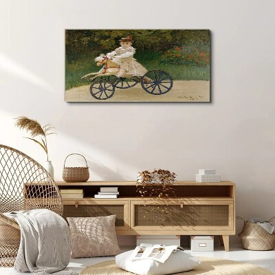 Child on a ride-on Canvas Wall art