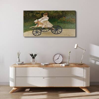 Child on a ride-on Canvas Wall art