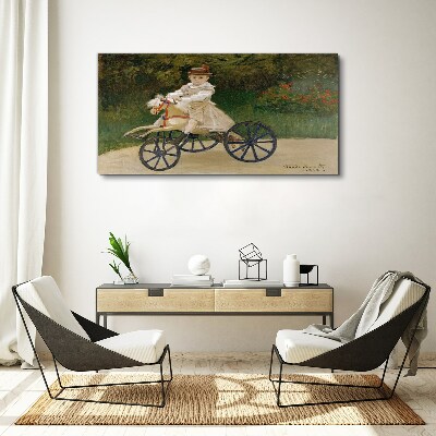 Child on a ride-on Canvas Wall art