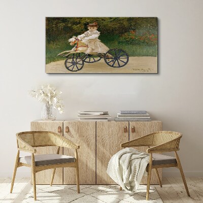 Child on a ride-on Canvas Wall art