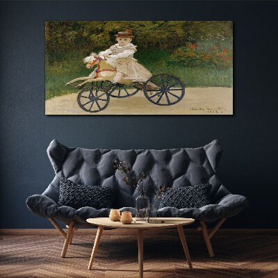 Child on a ride-on Canvas Wall art