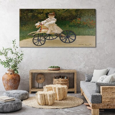 Child on a ride-on Canvas Wall art