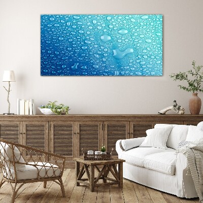 Water drops on a blue background Glass Wall Art