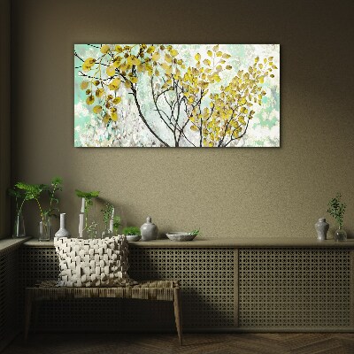 Spring leaves against the blue background Glass Wall Art