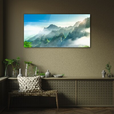 Mountain landscape on a misty morning Glass Wall Art