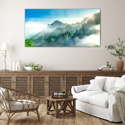 Mountain landscape on a misty morning Glass Wall Art