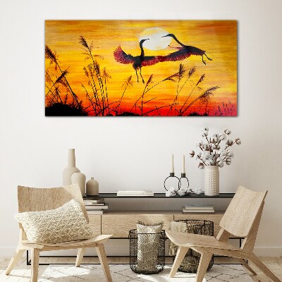 Dancing cranes at sunset Glass Wall Art