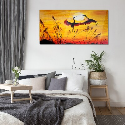 Dancing cranes at sunset Glass Wall Art