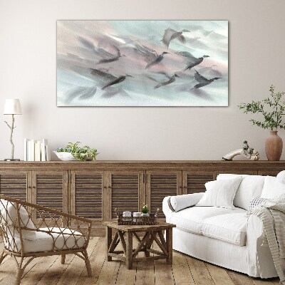 Flight of birds in a pastel aura Glass Wall Art