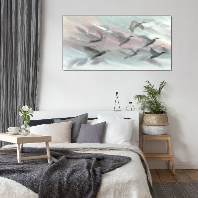 Flight of birds in a pastel aura Glass Wall Art